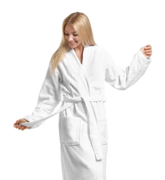 Beautiful young woman in bathrobe on white background — Stock Photo, Image