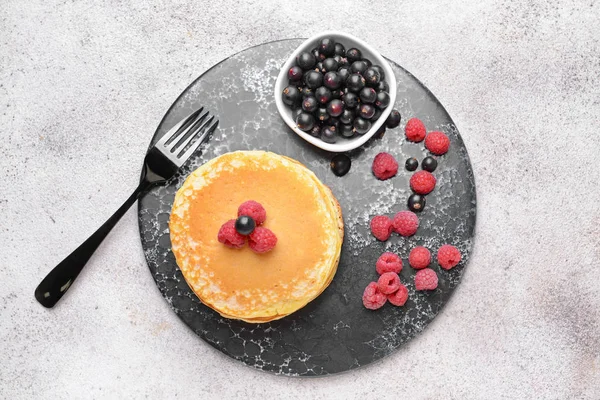 Tasty pancakes with berries on table — Stock Photo, Image