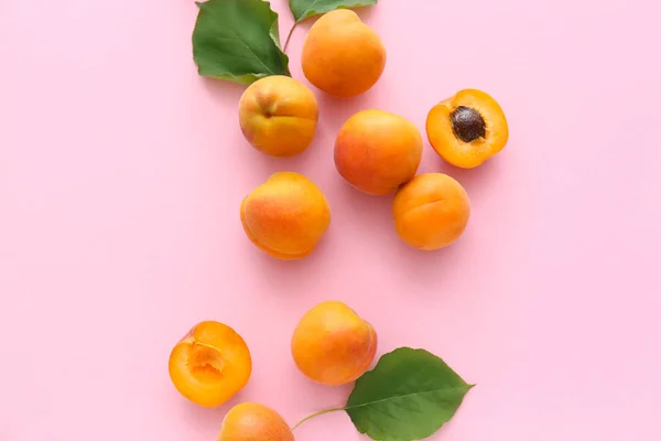 Tasty apricots on color background — Stock Photo, Image