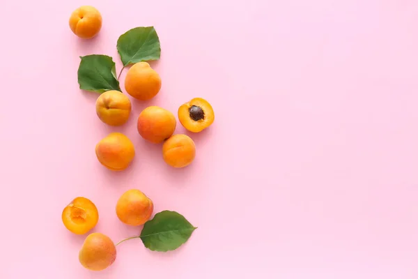 Tasty apricots on color background — Stock Photo, Image