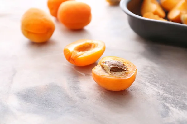 Tasty apricots on marble background — Stock Photo, Image