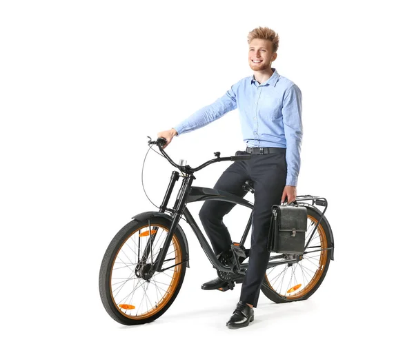 Jovem empresário com bicicleta no fundo branco — Fotografia de Stock