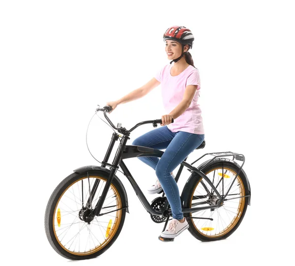 Schöne junge Frau mit Fahrrad vor weißem Hintergrund — Stockfoto