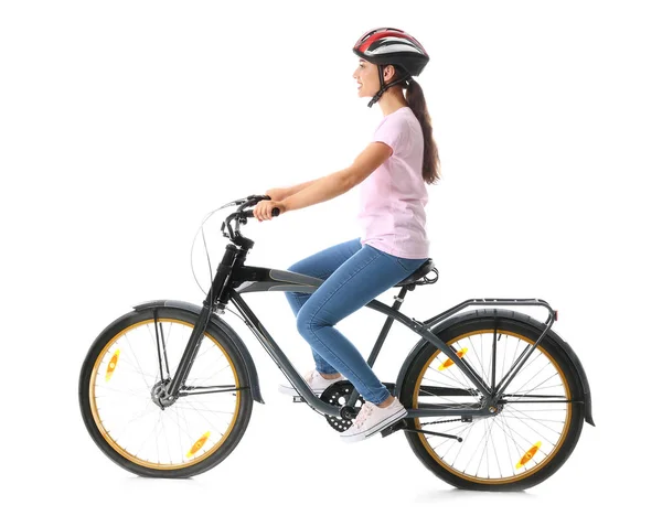 Beautiful young woman riding bicycle against white background — Stock Photo, Image