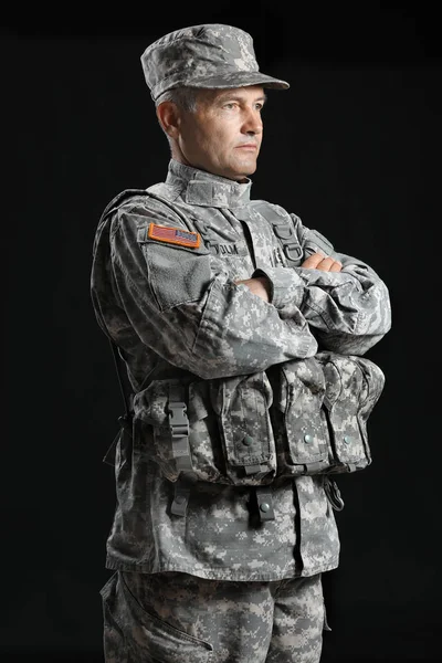 Mature male soldier on dark background — Stock Photo, Image