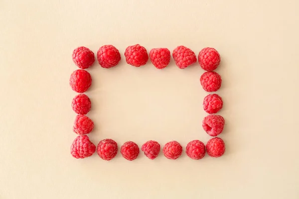 Frame made of sweet ripe raspberry on light background — Stock Photo, Image