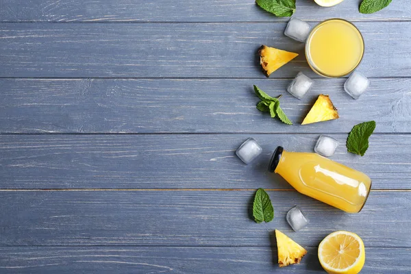 Composition with fresh pineapple juice on wooden table — Stock Photo, Image