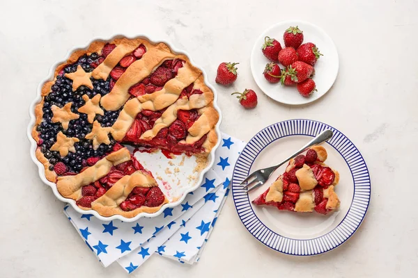 Composition with tasty American flag pie on light background — Stock Photo, Image