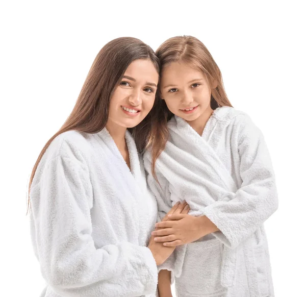 Mother and her little daughter in bathrobes on white background — Stock Photo, Image