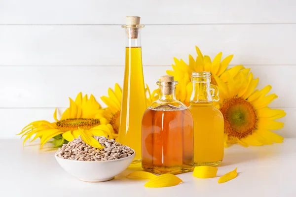 Composition with sunflower oil and seeds on table — Stock Photo, Image