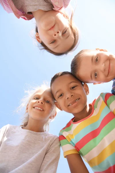 Portrait of cute little children outdoors, bottom view — Stock Photo, Image