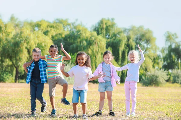 Group of happy children in park — Stock Photo, Image