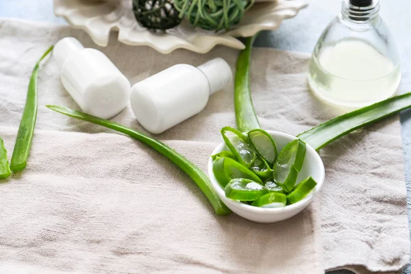 Composition with aloe vera and cosmetics on table — Stock Photo, Image