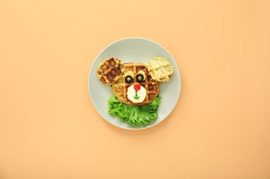 Renkli arka planda kabak waffle yapılmış komik hayvan ile Plaka