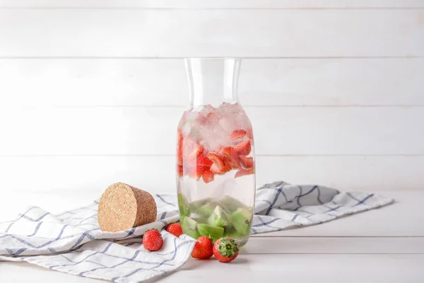 Bottle of fresh infused water on table — Stock Photo, Image
