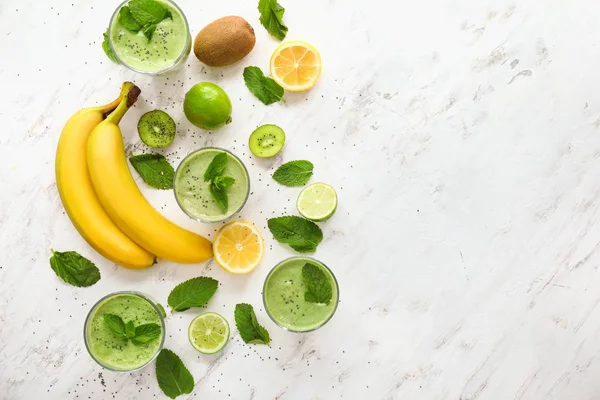 Composition with glasses of healthy fruit smoothie on table — Stock Photo, Image