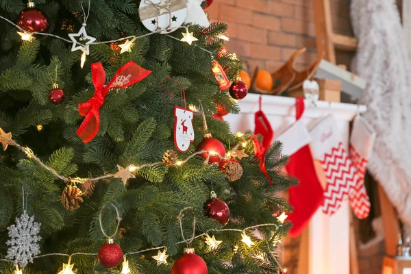 Beautifully decorated Christmas tree in room, closeup — Stock Photo, Image