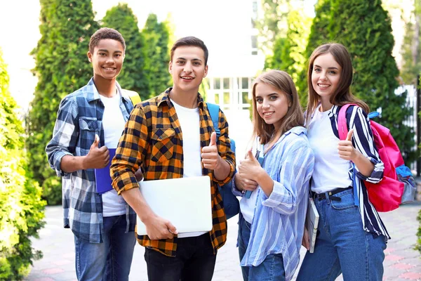 Portrait of young students outdoors — Stock Photo, Image