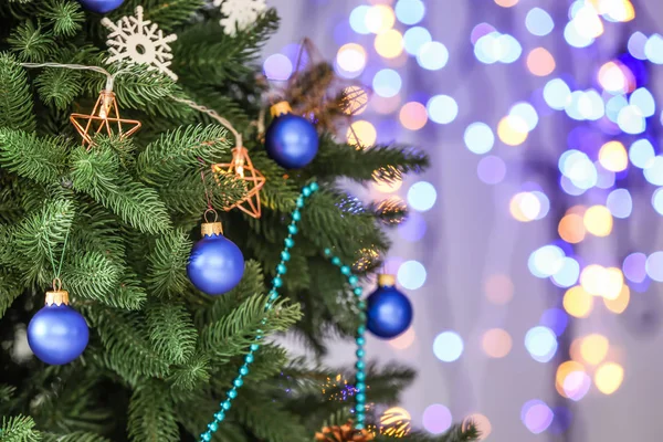 Beautiful Christmas tree against defocused lights, closeup — Stock Photo, Image