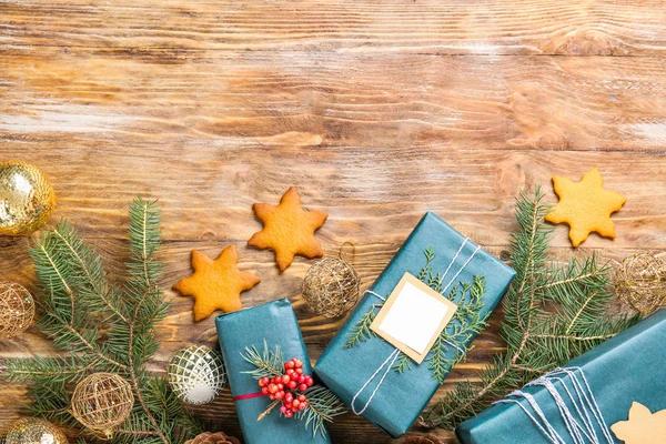 Beautiful Christmas gift boxes with cookies on wooden background — Stock Photo, Image