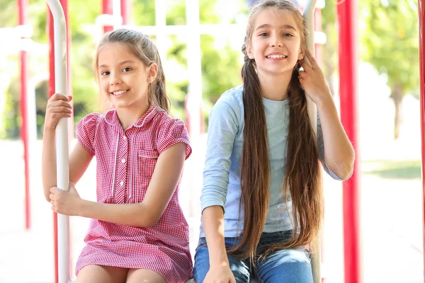 Cute little girls on playground — Stock Photo, Image