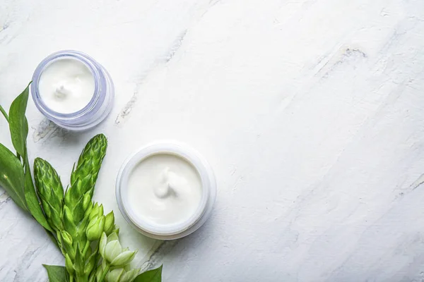 Jars of body cream on white background — Stock Photo, Image