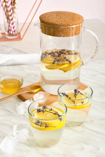 Tasty infused water on light table — Stock Photo, Image