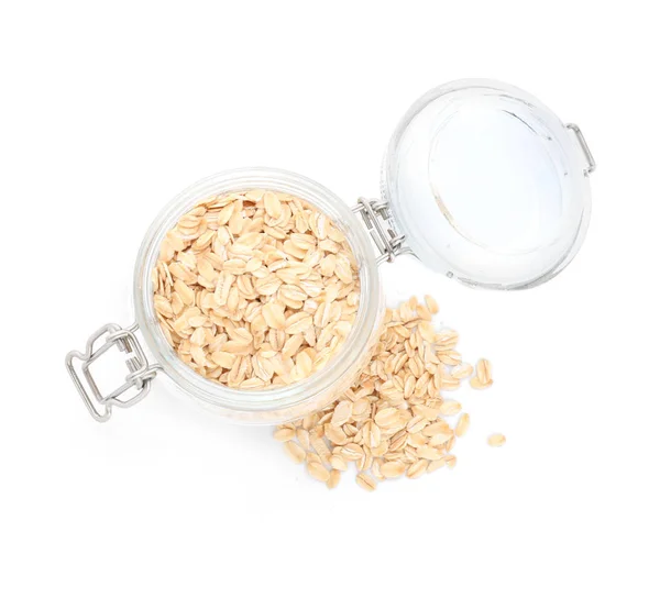 Jar with raw oatmeal on white background — Stock Photo, Image
