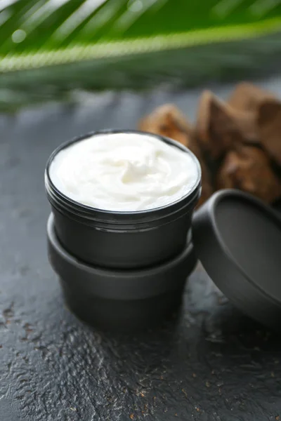 Jar of natural cream on dark background — Stock Photo, Image