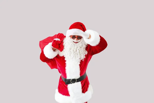 Portrait of cool Santa Claus on light background — Stock Photo, Image