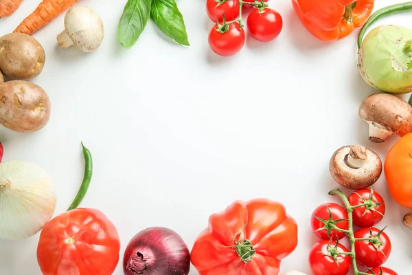Frame made of different fresh vegetables on white background — Stock Photo, Image