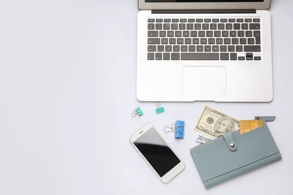 Laptop with wallet and mobile phone on white background — Stock Photo, Image