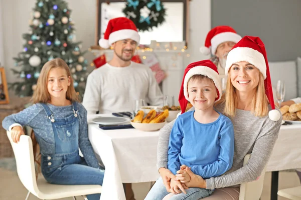 Happy mother with son during Christmas dinner at home — Stock Photo, Image