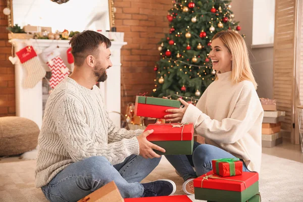 Happy couple greeting each other on Christmas eve — Stock Photo, Image