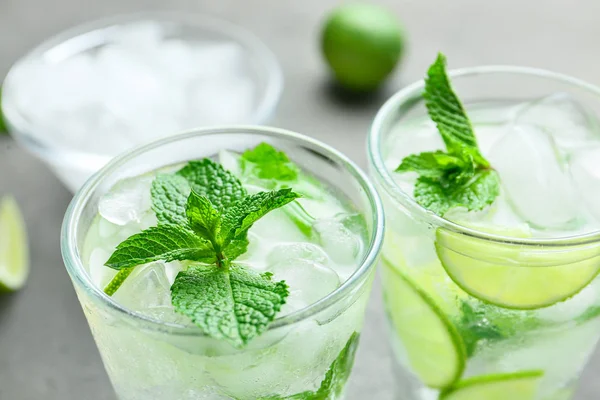 Glasses of fresh mojito on table, closeup — Stock Photo, Image