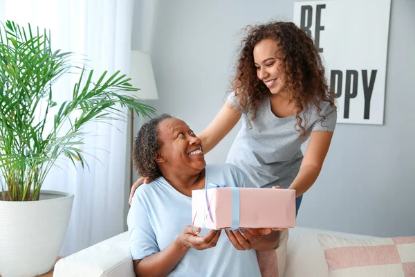 Portrait of African-American woman greeting her mother at home — Stock Photo, Image