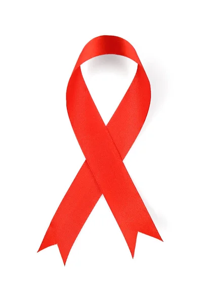 Red satin ribbon on white background. AID awareness concept — Stock Photo, Image