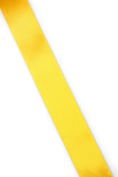 Yellow satin ribbon on white background — Stock Photo, Image