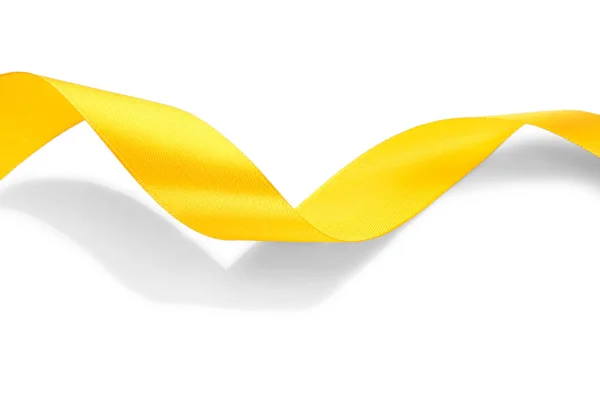 Yellow satin ribbon on white background — Stock Photo, Image