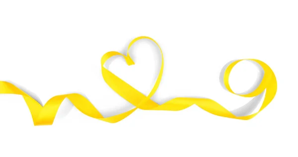 Heart made of yellow satin ribbon on white background — Stock Photo, Image