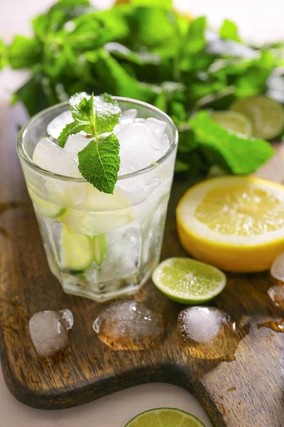 Glass of fresh mojito on wooden board — Stock Photo, Image