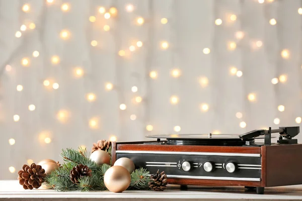 Record player and Christmas decor on table — Stock Photo, Image