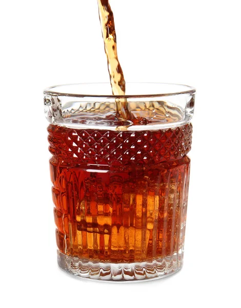 Pouring of whiskey into glass on white background — Stock Photo, Image