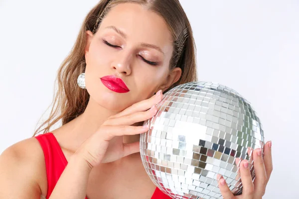 Fashionable young woman with disco ball on white background — Stock Photo, Image
