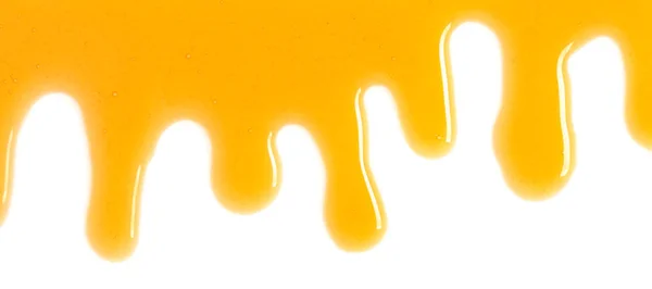 Розлитий мед на білому тлі — стокове фото