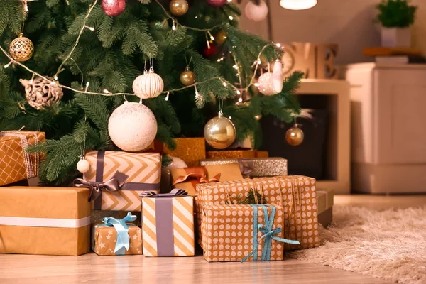 Many beautiful gift boxes under Christmas tree — Stock Photo, Image