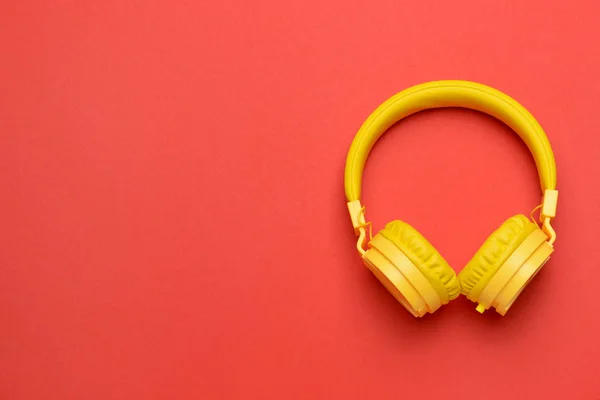 Modern headphones on color background — Stock Photo, Image