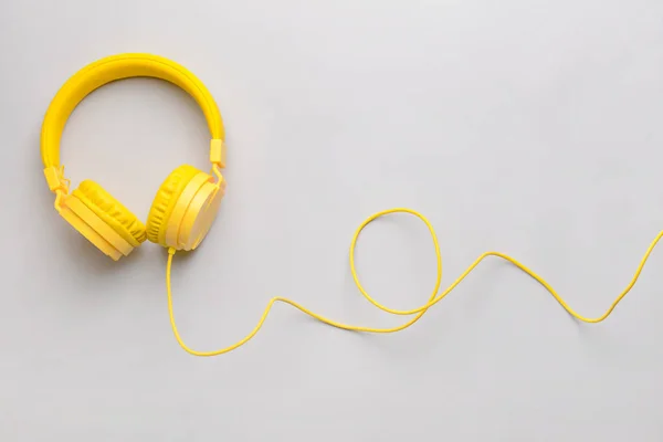 Modern headphones on light background — Stock Photo, Image