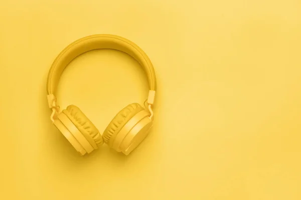 Modern headphones on color background — Stock Photo, Image