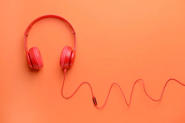 Modern headphones on color background — Stock Photo, Image